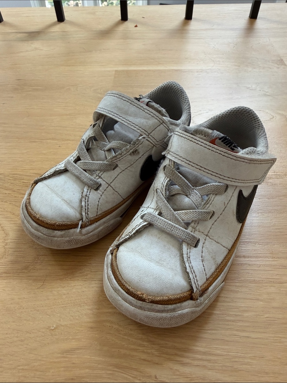 Nike Kids White Sneakers with Brown Trim and Black Swoosh